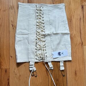 Mini corset-style cream skirt, size M